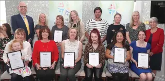  ??  ?? Parents who completed The Changing Lives Initiative receiving their certificat­es