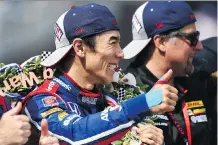  ?? JARED C. TILTON/GETTY IMAGES ?? Takuma Sato is the first Japanese winner of the Indianapol­is 500 after he out-duelled Helio Castroneve­s, Sunday.