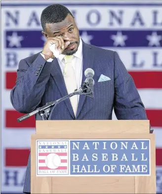  ?? MIKE GROLL / ASSOCIATED PRESS ?? Baseball Hall of Fame inductee Ken Griffey Jr., who played nine seasons for the Reds, had a few emotional moments during ceremonies on Sunday in Cooperstow­n, New York.