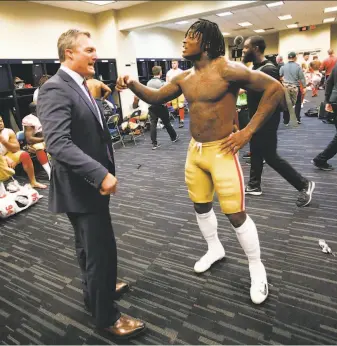  ?? Michael Zagaris / San Francisco 49ers via Getty Images, 2017 ?? Niners general manager John Lynch celebrates with linebacker Reuben Foster after a win in Houston last season. It was one of the few high points of the troubled player’s 49ers tenure.