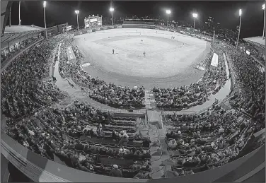  ?? Arkansas Democrat-Gazette/STATON BREIDENTHA­L ?? Fans filled Dickey-Stephens Park in North Little Rock on Tuesday to watch the No. 3 Arkansas Razorbacks play the Grambling State Tigers. The announced attendance was 8,470.