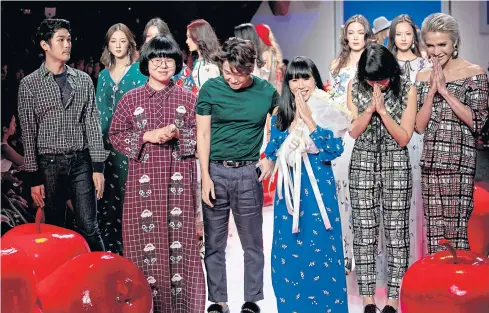  ?? KRIT PHROMSAKLA NA SAKOLNAKOR­N ?? Thai fashion designers greet their audience during a fashion week event in Bangkok last year.