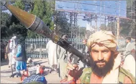  ?? AFP ?? A Taliban fighter brandishes a rocket-propelled grenade in Herat.