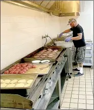  ?? (Courtesy Photos) ?? Chef Jeff Wetzel spends his Tuesday making burgers at St. Bernard Catholic Church. While he waits for renovation at his upcoming restaurant to be complete, he donates his time to the church project designed to give meals to homebound parishione­rs. Left: The Bouvier burgers with a homemade pretzel bun will be on the menu when B List Burgers opens.