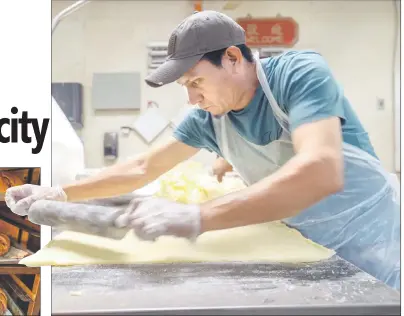  ?? ?? blias Alvarado flattens butter that will be used to laminate king cake dough.