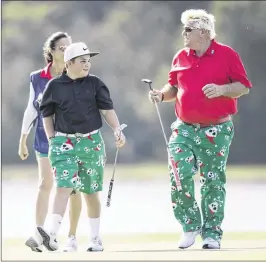  ?? WILLIE J. ALLEN JR. / ASSOCIATED PRESS ?? John Daly and his son Little John, showing off their matching attire Saturday, finished tied for ninth in the Father/Son Challenge in Orlando, Fla.