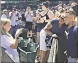  ??  ?? Aaron Judge’s parents (top) lead cheers Saturday for homecoming hero as scores of Linden, Calif., residents travel to Oakland to see favorite son.