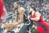  ?? FRANK GUNN — THE CANADIAN PRESS ?? Brooklyn Nets forward Kevin Durant (7) looks to move the ball as Toronto Raptors guard Fred VanVleet (23) defends during the second half Sunday in Toronto.