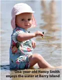  ?? Katie.bellis@walesonlin­e.co.uk ?? > One-year-old Nancy Smith enjoys the water at Barry Island