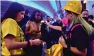  ??  ?? Hong Kong supporters distribute T-shirts outside the Staples Center before the Lakers v Clippers NBA season opener. Photograph: Frederic J Brown/AFP via Getty Images