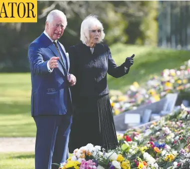  ?? JEREMY SELWYN/POOL/AFP VIA GETTY IMAGES ?? Prince Charles and Camilla, Duchess of Cornwall, visit the gardens of Marlboroug­h House in London on Thursday to view the flowers and messages of condolence left by members of the public following the death of Prince Philip.