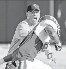  ?? Al Seib Los Angeles Times ?? CLAY HELTON will be the fourth coach in four years to lead USC as it faces rival Notre Dame. It will be the Trojans’ first game since Steve Sarkisian was fired.