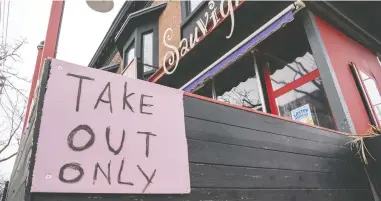  ?? FRANK GUNN / THE CANADIAN PRESS ?? A restaurant in Toronto displays a Take Out Only sign on Wednesday. Effective Tuesday in
Ontario all bars — including local legions and restaurant­s — are closed indefinite­ly.