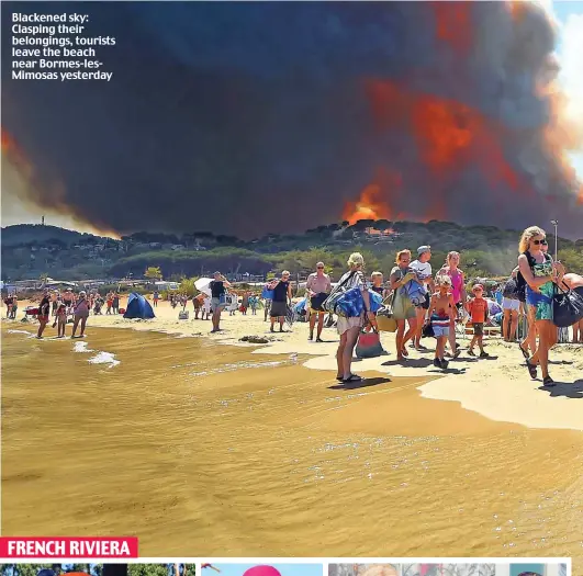  ??  ?? Blackened sky: Clasping their belongings, tourists leave the beach near Bormes-lesMimosas yesterday FRENCH RIVIERA