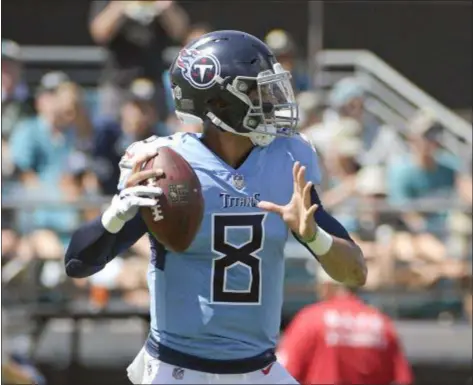  ?? PHELAN M. EBENHACK — THE ASSOCIATED PRESS ?? The Eagles get their first look at Tennessee Titans quarterbac­k Marcus Mariota this weekend in Nashville. The Birds considered moving up to take Mariota in the 2015 NFL Draft.