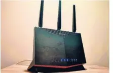  ?? TYLER LIZENBY/CNET ?? Gaming features aside, Asus RT-AX86U offers full support for Wi-Fi 6.