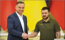  ?? EFREM LUKATSKY/ASSOCIATED PRESS ?? Polish President Andrzej Duda (left) shows solidarity Sunday with Ukrainian President Volodymyr Zelenskyy during a news conference after their meeting in Kyiv, Ukraine.