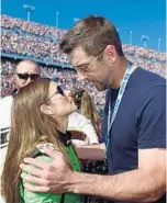  ?? JARED C. TILTON/GETTY IMAGES ?? Danica Patrick shares a moment with boyfriend Aaron Rodgers before the start of Sunday’s race.