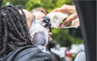  ?? Danielle Wedderburn / Contribute­d photo ?? Protesters gather in Bridgeport on Saturday.