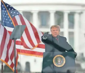  ?? EVAN VUCCI/AP ?? President Donald Trump encourages protesters to “walk down to the Capitol” where lawmakers were set to confirm Joe Biden as president Jan. 6 before a group of rioters breached the U.S. Capitol.