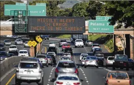  ?? ANTHONY QUINTANO / CIVIL BEAT VIA AP ?? A highway sign informs motorists on a Honolulu freeway that there is no threat of a missile attack, as was reported in error by the Hawaii Emergency Management Agency. State officials said human error was the cause of the erroneous announceme­nt. It...