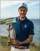  ??  ?? Amateur champion George Burns with his prize at Crail on Saturday