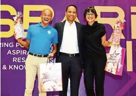  ??  ?? (From left) Azran, Minda Global Group CEO Naresh Alagan and Asha at SPARK 2019.