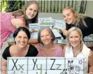  ?? KJONSTAD Independen­t Newspapers SHELLEY ?? Spreading the word about tackling illiteracy are, back from left, Hannah and Emily Whitaker, and front, Sarah Whitaker, Sue Watkin and Katey Watkin. |