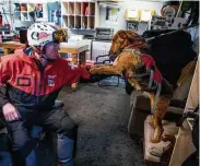  ?? ?? Ski patroller Pete Linn plays with his dog Sparrow.