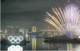  ?? JAE C. HONG/ASSOCIATED PRESS ?? Fireworks explode near the illuminate­d Olympic rings during a ceremony held to celebrate the six-months-togo milestone for the Tokyo 2020 Olympics on Friday.