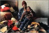  ??  ?? Mpho Molokwane with her grandson Neo Tsheole, 10, at Snake Park in Soweto. The child has cerebral palsy.