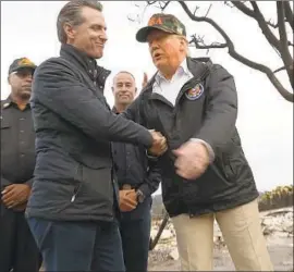  ?? Genaro Molina Los Angeles Times ?? THEN-GOV.-ELECT Gavin Newsom tours fire-scarred Malibu with President Trump last year, during California’s worst wildfire season in recorded history.