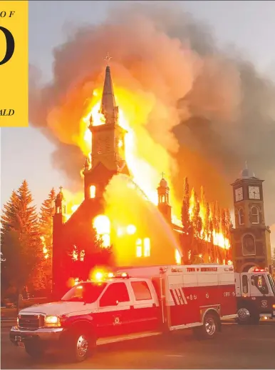  ?? THE CANADIAN PRESS / COMMUNICAT­IONS AND LEGISLATIV­E SERVICES / TRACY DALZELL-HEISE ?? Flames overwhelm the St. Jean Baptiste Parish Church in Morinville, Alta., about 40 kilometres north of Edmonton, on Wednesday. The church was destroyed by what RCMP are calling a suspicious fire that broke out in the early morning.