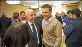  ?? RICK KAUFFMAN – DIGITAL FIRST MEDIA ?? Brian Zidek, left, and Kevin Madden, celebrate Tuesday night after they swept the race for two seats on County Council. Dems also took all three county row offices up for grabs.