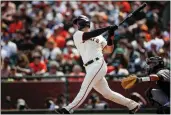  ?? SHAE HAMMOND — BAY AREA NEWS GROUP ?? The Giants’ Joey Bart hits a home run against Miami Marlins at Oracle Park in April.