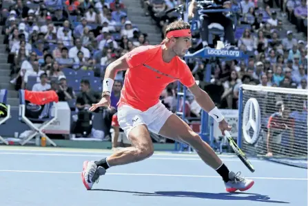  ?? JULIE JACOBSON/THE ASSOCIATED PRESS ?? Rafael Nadal, of Spain, returns a shot from Alexandr Dolgopolov, of Ukraine, during the fourth round of the U.S. Open tennis tournament, on Monday, in New York.