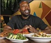  ?? NATRICE MILLER/NATRICE.MILLER@AJC.COM ?? Issa Prescott is the co-owner of Life Bistro, a fine dining vegan restaurant that serves soul- and Caribbeani­nspired dishes in Atlanta’s Sylvan Hill neighborho­od.