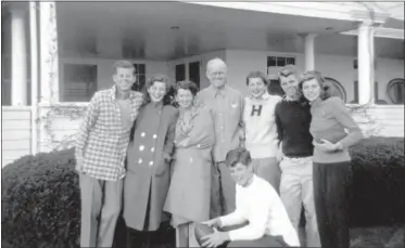  ?? KENNEDY FAMILY COLLECTION — JOHN F. KENNEDY LIBRARY FOUNDATION VIA AP ?? In this circa 1948photo provided by the Kennedy Family Collection, courtesy of the John F. Kennedy Library Foundation, members of the Kennedy family pose for a photo in Hyannis Port, Mass. They are from left, John F. Kennedy, Jean Kennedy, Rose Kennedy, Joseph P. Kennedy Sr., Patricia Kennedy, Robert F. Kennedy, Eunice Kennedy, and in foreground, Edward M. Kennedy. The Boston-based museum completed an 18-month project in 2018to catalog and digitize more than 1,700black-and-white Kennedy family snapshots that are viewable online, giving a nation still obsessed with “Camelot” a candid new glimpse into their everyday lives.