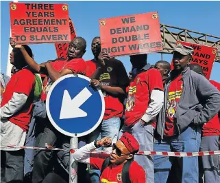  ?? /Alon Skuy ?? Power play: Picketing at Eskom in 2014. The National Union of Metalworke­rs of SA, along with the National Union of Mineworker­s, have organised pickets around the country after wage talks with Eskom collapsed.