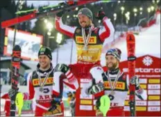 ?? MARCO TROVATI — THE ASSOCIATED PRESS ?? Marcel Hirscher, center, the winner of the men’s slalom, celebrates with second-placed Michael Matt, left, and third-placed Marco Schwarz in an all-Austrian podium at the World Championsh­ips in Are, Sweden, Sunday.
