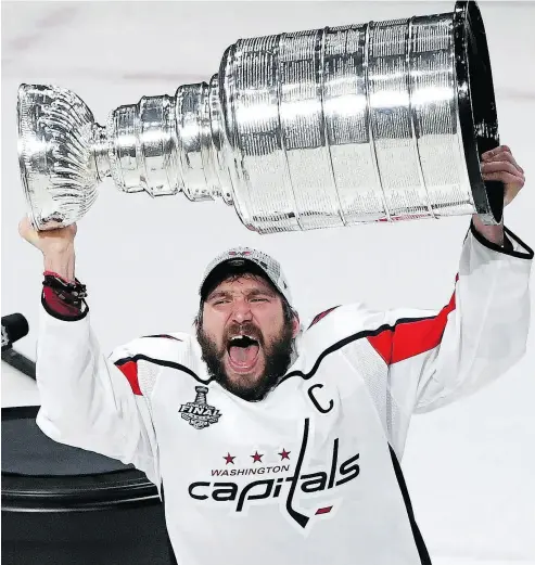  ?? ETHAN MILLER / GETTY IMAGES ?? A jubilant Alexander Ovechkin hoists the Stanley Cup after Thursday night’s win over Vegas.