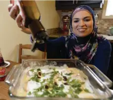  ?? AARON HARRIS FOR THE TORONTO STAR ?? Uzma Jalaluddin prepares a snack during Ramadan. She found out people, regardless of faith, fast for the same reasons: family and faith.