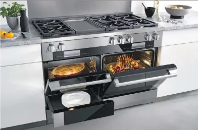  ??  ?? The Miele 48-inch range is a “one-stop culinary centre” featuring six gas burners, a hot plate and three ovens. Those ovens include a speed oven that incorporat­es an oven for dry cooking and a microwave; a steam oven with “moisture plus capabiliti­es”;’...