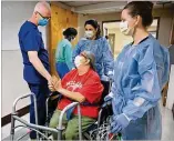  ??  ?? Glenda Bailey (in wheelchair), a Miller County residentwh­o is recovering fromCOVID-19, stops to thank Dr. Bill Swofffford (left) as she is assisted by staffffers Carmen Lambert and Jamie Middleton.