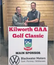  ?? ?? Chris Kenny representi­ng the Mick Barry Heating and Plumbing team that took 4th place in the GUI section at our recent golf classic, receiving team prizes from Ned O’Brien.