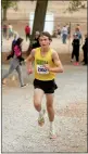  ?? Dominic Massimino / Union Democrat ?? Sonora sophomore Broen Holman powers up a hill as he leads the CIF Sac-joaquin subsection cross country championsh­ips.