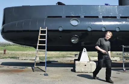  ?? AP ?? Danish entreprene­ur Peter Madsen with his 18m long submarine, Nautilus.