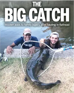  ?? PROVIDED BY JACKSON KENNEDY ?? Ryan Wooten (left) and Jackson Kennedy with Wooten’s 42-inch, 31 3/4-pound flathead shortly after it was netted last week on the Fox River.