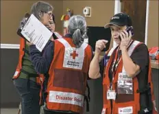  ??  ?? Members of the American Red Cross work at a shelter set up for residents who were evacuated from their homes.