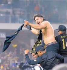  ?? H.W. CHIU/ASSOCIATED PRESS ?? Fans of Los Angeles FC celebrate their recent in win in extra time over Seattle, but some of those fans at Banc of America Stadium were heard on television chanting an offensive Spanish word.